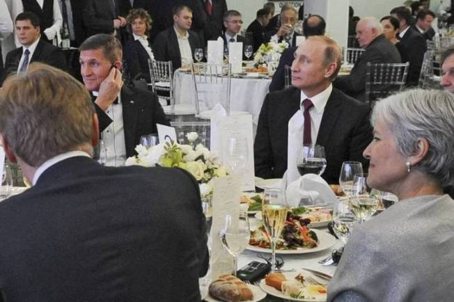 Both Jill Stein and Mike Flynn are sitting at table with Russian President Putin